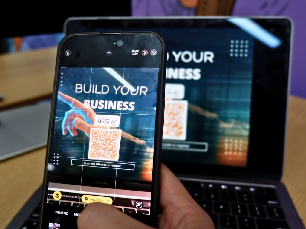A person scanning a QR code to register for an upcoming company event.